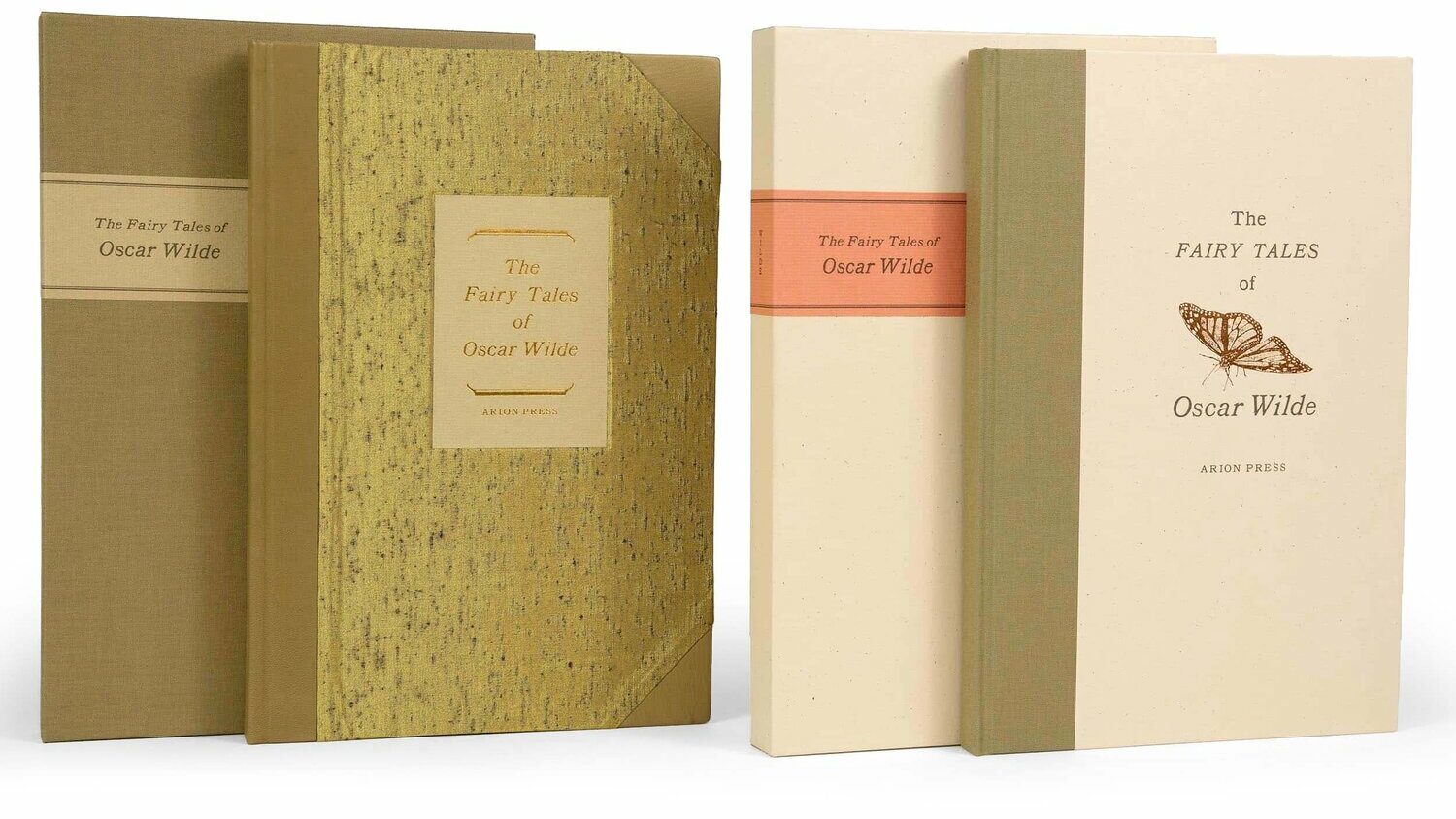 A photograph of two fine press editions of The Fairy Tales of Oscar Wilde by Arion Press. Both are exquisitely bound in sage bookcloth with understated type and illustrations.