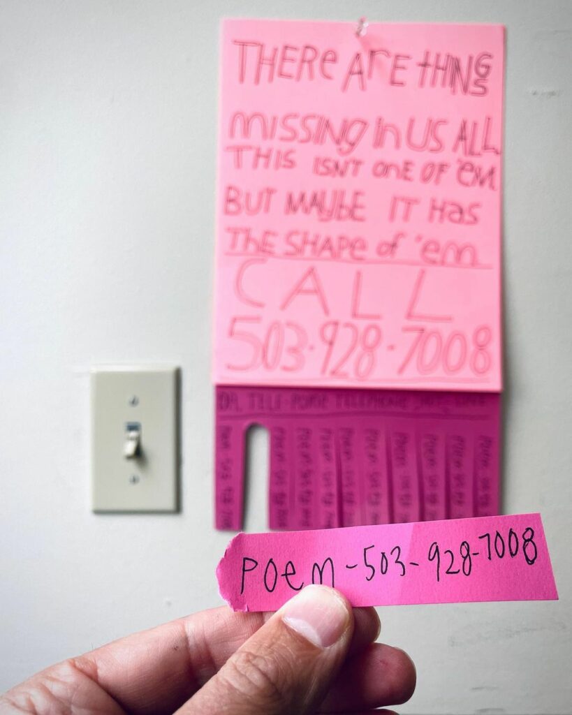 A photo of a hand holding a slip of paper torn from a sign with many such slips on the bottom. It's blurry in the background, but says There are things missing in us all. This isn't one of ’em, but maybe it has the shape of ’em. Call 503-928-7008.