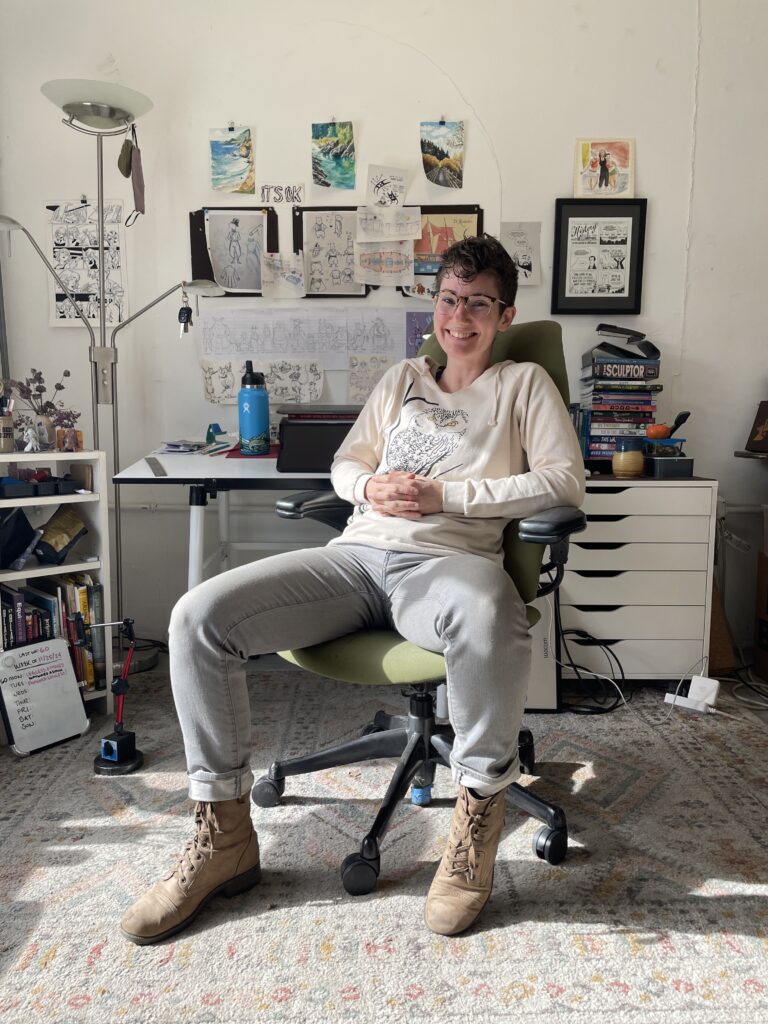 Lucy sitting in a sunbeam in her studio.